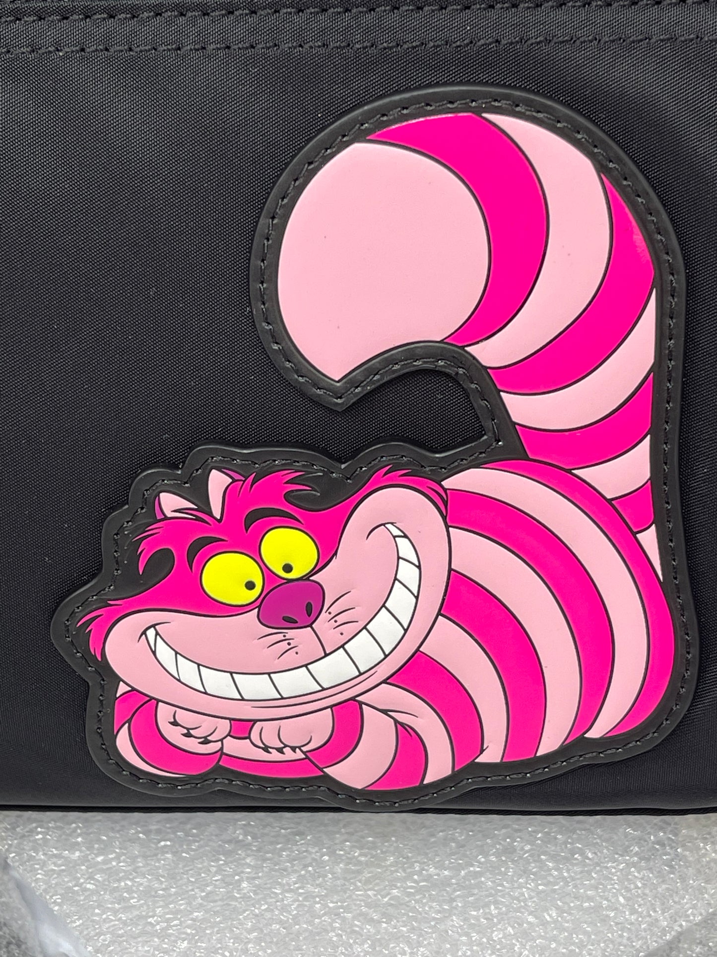 Cheshire cat purse hotsell